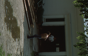 Barn beams pile in front of the Carriage House before the Moon Barn Raising at entrance to Hopkins Forest on 2 August 1975.