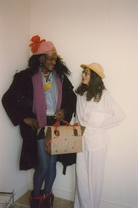Photographs of Marsha P. Johnson Wearing a Pink Hat with a Red Bow and Black Coat with Her Friend Judy