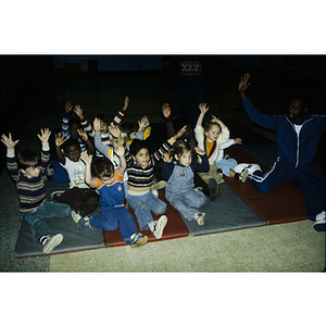 Young children stretching in a fitness class