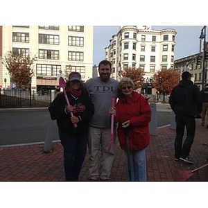 Trio poses for picture in Kenmore Square with their tools