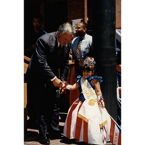 Mayor Thomas Menino shakes hands with the Reina Infantil, the Child Queen, of the Festival Puertorriqueño