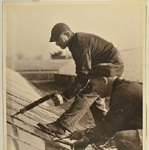 Workers repairing glass roof