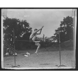 Youth doing highjump at Camp School, Allston