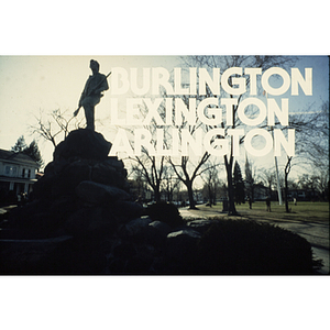 Advertisement for Burlington, Lexington and Arlington featuring a photo of a statued figure holding a rifle