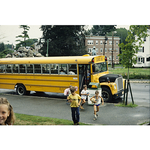 Children unboarding a school bus