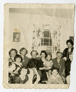 Women and children posing at Mello house