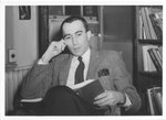 Suffolk University Professor Donald Unger (CAS) reading a book, photograph, circa 1960s