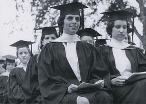 Six seated female students at graduation, 1964.
