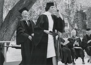 Graduates standing under a tree, 1964.