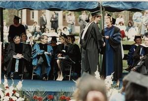College President Alice F. Emerson Grants a Diploma, I.