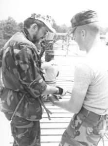 Suffolk University Dean Richard M. McDowell (SOM, 1974-1991), suiting up for rappelling at the RECON DO, ROTC Advanced Camp at Fort Bragg, North Carolina