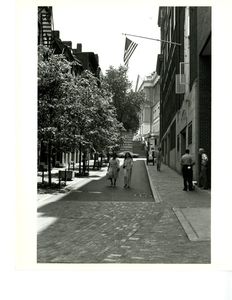 View of people walking down Temple Street