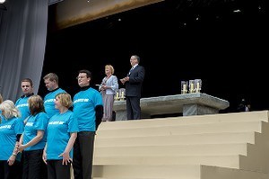 Joe Duffy and Eileen Dunne, RTE presenters, with members of one choir on the stage at the 2012 50th Eucharistic Congress, Final Day Ceremony, 17th June, at Croke Park GAA Stadium, Dublin