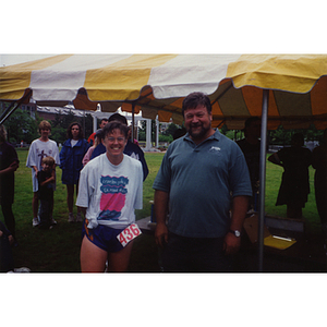 A woman and a man pose for a shot at the Battle of Bunker Hill Road Race