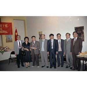 People posing for a photograph at a welcome party for the Consulate General of the People's Republic of China