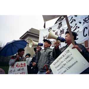 Speakers at a protest opposing construction in Chinatown
