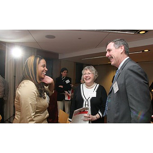 Ana Hidalgo converses with a man and woman at a Torch Scholars event