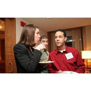 Meghan Allen-Eliason speaks to Odalis David Polanco at a Torch Scholars event