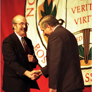 Dean Lowdnes and Lech Walesa shake hands at the inauguration of the International Degree Program