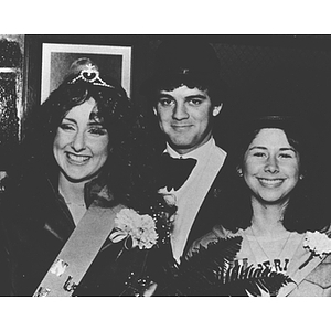 A Homecoming Queen with two others