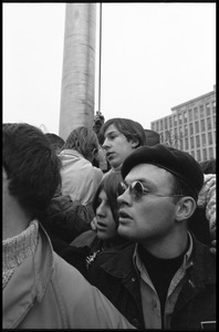 Anti-Vietnam War protesters (close-up) gathered around the flagpole in front of the HEW Building, during the Counter-inaugural demonstrations, 1969