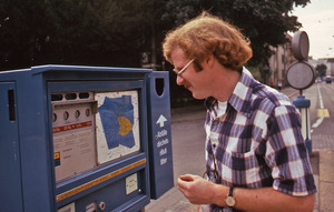 Man buying a ticket for public transportation in Switzerland