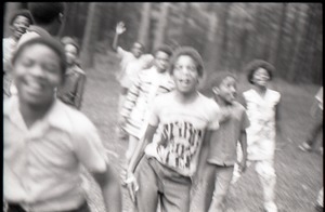 Inner City Round Table of Youth campers: group of African American children at summer camp, running toward camera (blurry)