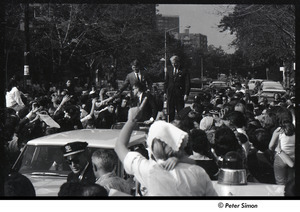 Robert Kennedy and Kenneth Keating campaigning in Riverdale: Robert Kennedy standing in car shaking hands