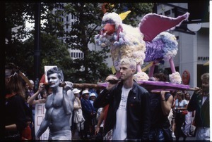 Marchers in the San Francisco Pride Parade carrying a litter bearing a winged beast