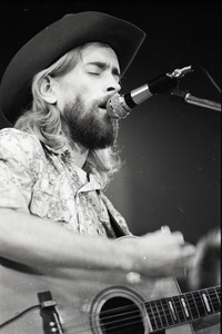 New Riders of the Purple Sage opening for the Grateful Dead at Sargent Gym, Boston University: John 'Marmaduke' Dawson playing acoustic guitar and signing