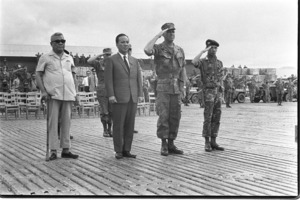 President Nguyen van Thieu and Premier Tran van Huong salute the flag at An Hoa Valley.