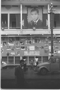 Huge Sihanouk portrait displayed on wall of information office in Phnom Penh, Cambodia.