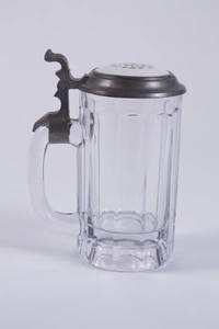 Pressed glass stein with porcelain inlay lid