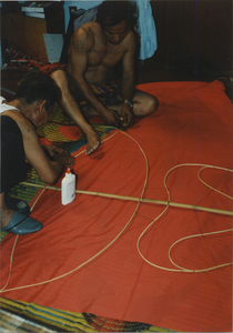 Kite Making: The kite's covering is cut and glued section by section, 1987