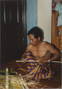 Kite Making: Soeun Tim shaves down a bamboo splint, 1987