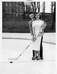 Student with date on Ice Hockey Rink, 1957