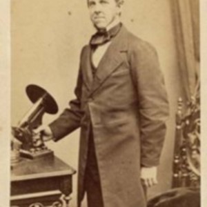 Oliver Wendell Holmes with his microscope