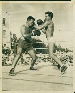 John Joseph Moakley, a.k.a. the "Boston Bull" (on the left) boxing in outdoor ring, circa 1947