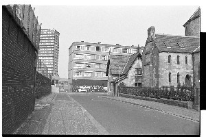 Divis Flats, Falls Road, Belfast (later demolished). Various shots including some of Irish American businessman and musician Paddy Noonan standing in front of the flats