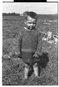 Young boy traveller wearing a skirt, a tradition carried from the West of Ireland to prevent the boy from being "stolen" by the fairies