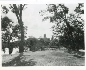 Gasson Hall exterior from grass on opposite side of reservoir by Clifton Church