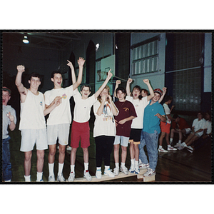 Teenagers stand on a balance beam at the "Best Year" activity at the Charlestown gymnasium