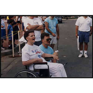 A woman and a man watch the Bunker Hill Road Race