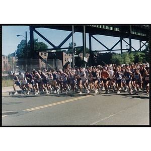 Runners leave the start line of the Battle of Bunker Hill Road Race