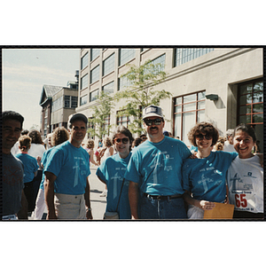 Race officials pose with a runner at the Battle of Bunker Hill Road Race