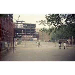 Street view of a city park and construction site for a Tufts-New England Medical Center building project in Boston's Chinatown