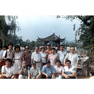 Men and women pose in a Chinese botanical garden