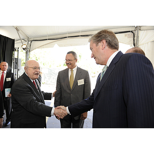 Dr. George J. Kostas greets US Congressman John F. Tierney at the groundbreaking ceremony