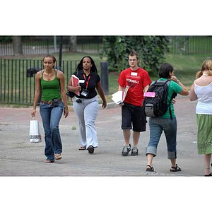 Torch Scholars walk through campus during a scavenger hunt