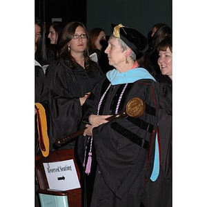 Faculty member and students at School of Nursing convocation